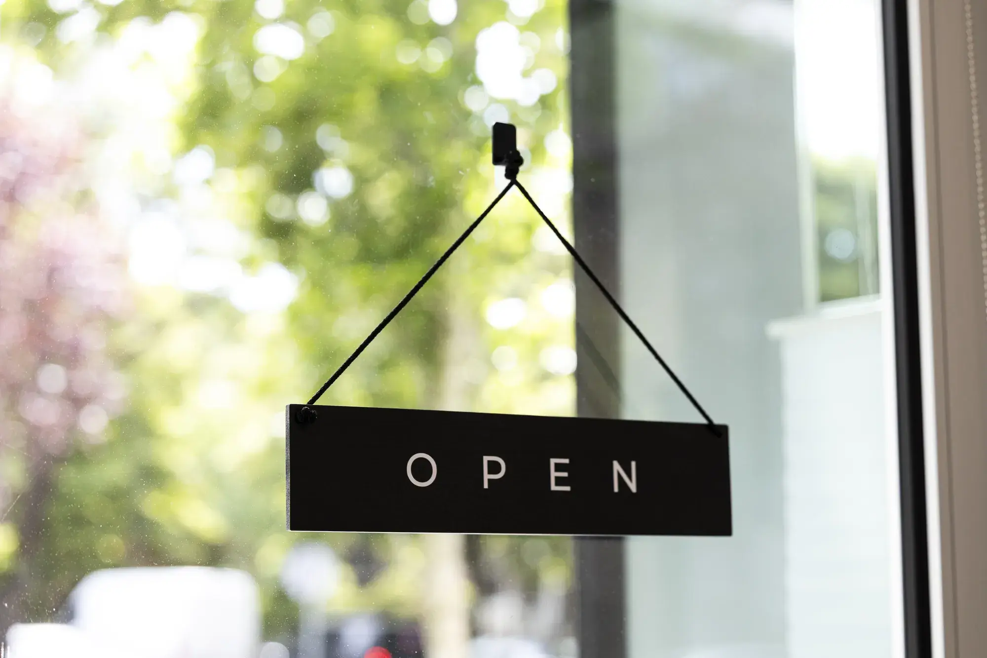 Open sign hanging in the clinic window