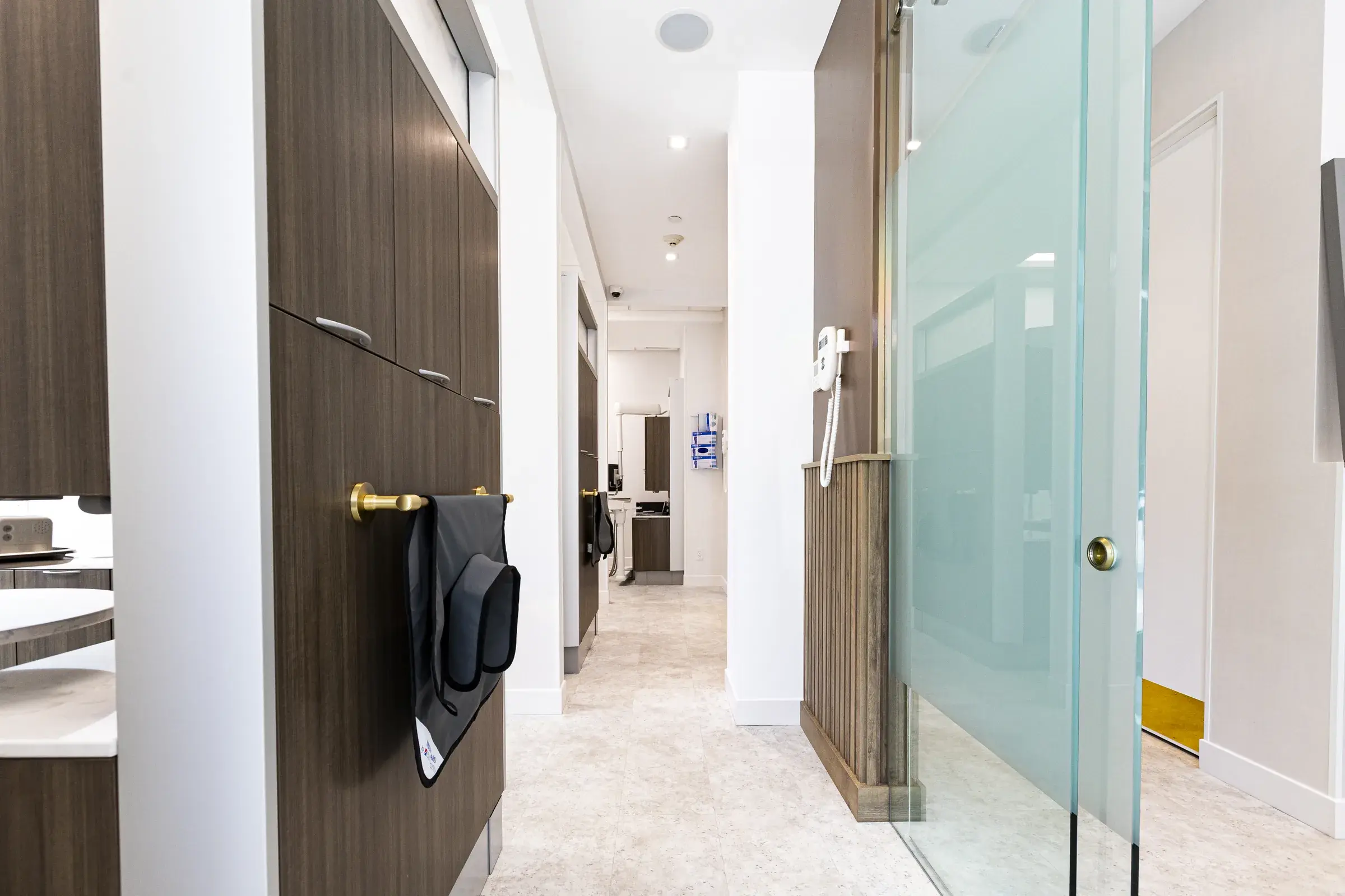Clinical corridor with glass doors at Heather Street Dental